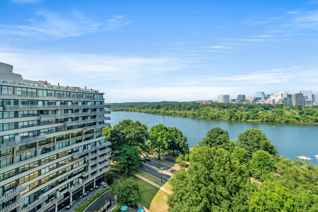 Private balcony at the Watergate condo offering panoramic views of the Potomac River and Arlington skyline.