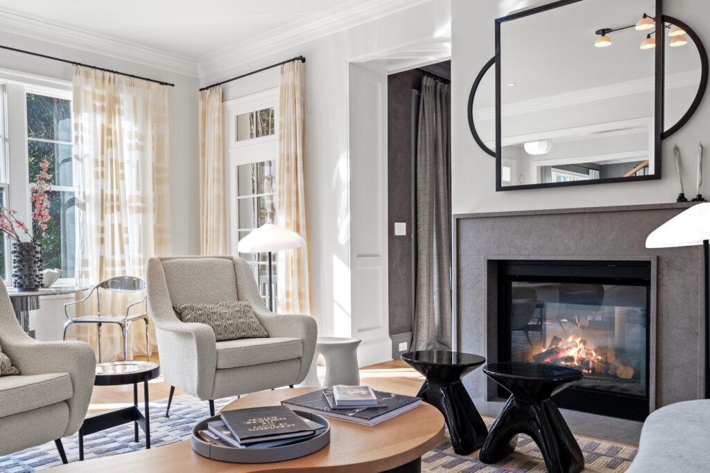 Cozy living room vignette featuring a luxury fireplace in a Bethesda home, highlighting upscale interior design.